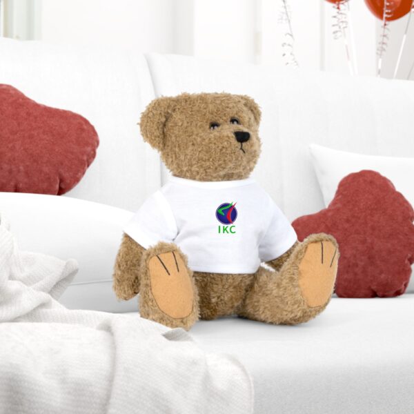 Cute teddy bear wearing an IKC T-shirt: a tender and heartwarming gift for children, celebrations, and collectors.